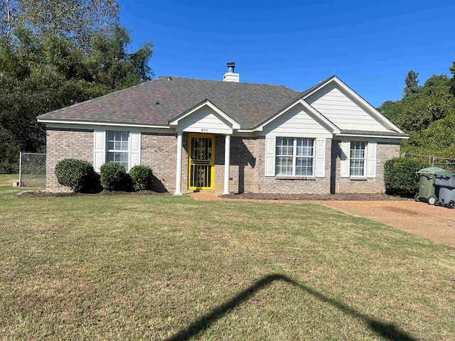 ranch-style home featuring a front yard