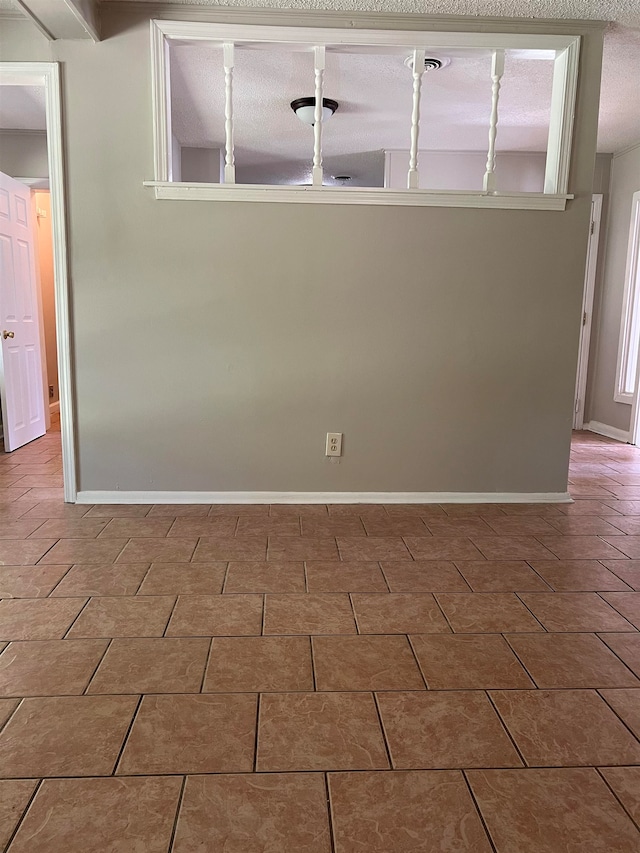 empty room with a textured ceiling