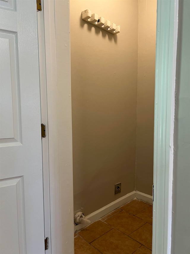 laundry area with tile patterned floors