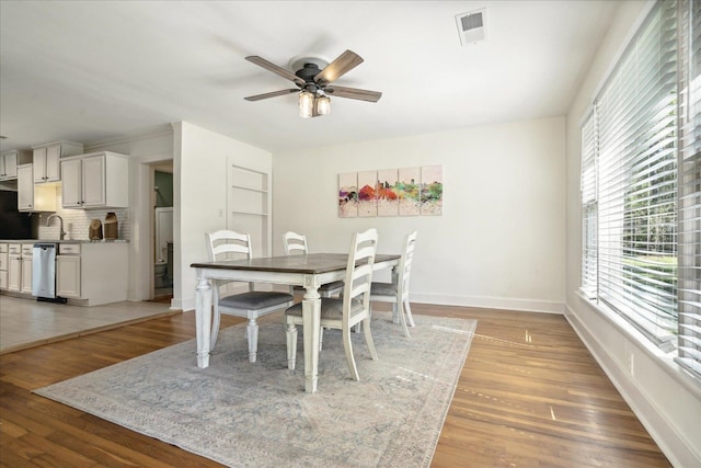 dining area featuring ceiling fan and hardwood / wood-style floors