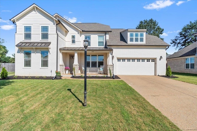 view of front facade featuring a garage and a front lawn