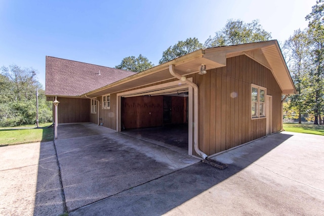 view of side of property with a garage