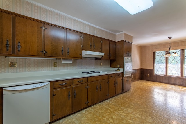 kitchen featuring wood walls, a chandelier, white appliances, hanging light fixtures, and ornamental molding