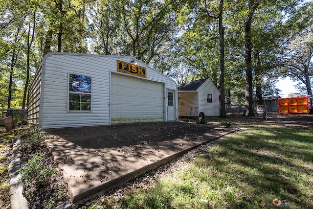 garage featuring a yard