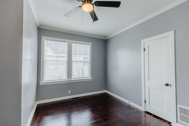 unfurnished room featuring ornamental molding, dark hardwood / wood-style flooring, and ceiling fan