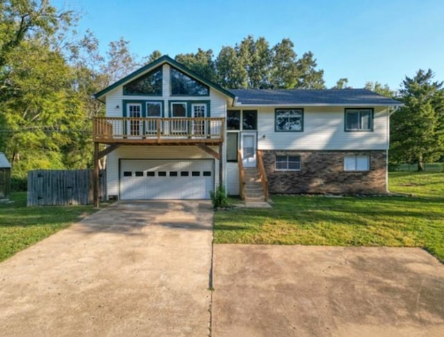 view of front of home featuring a garage and a front lawn