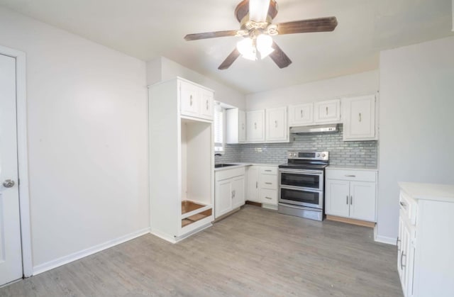 kitchen with ceiling fan, white cabinetry, light hardwood / wood-style flooring, and electric range