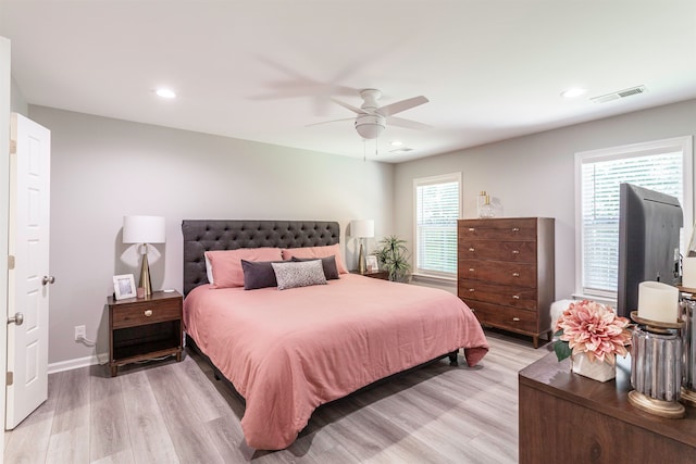 bedroom featuring ceiling fan and light hardwood / wood-style floors