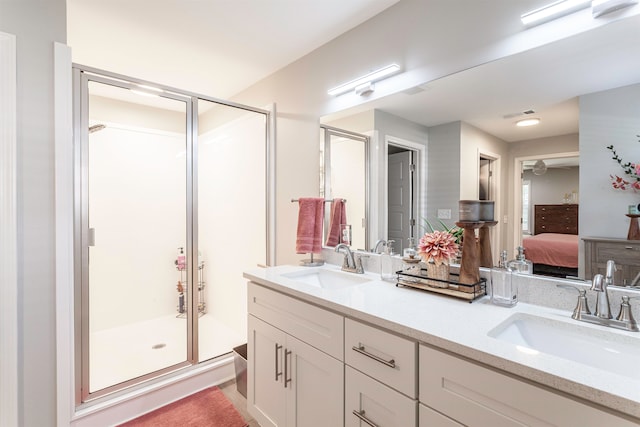 bathroom featuring vanity and an enclosed shower