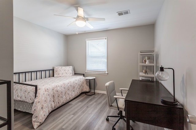 bedroom with light wood-type flooring and ceiling fan