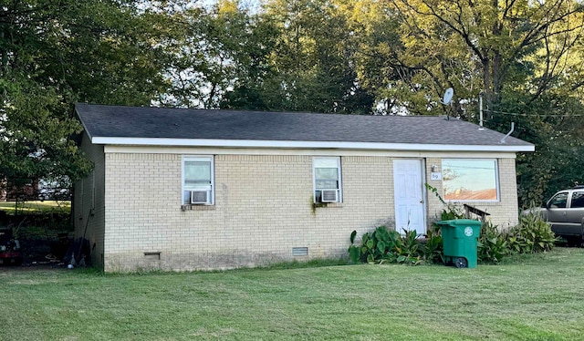 back of property with cooling unit and a yard