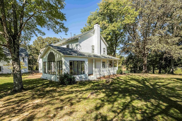 view of side of home featuring a yard