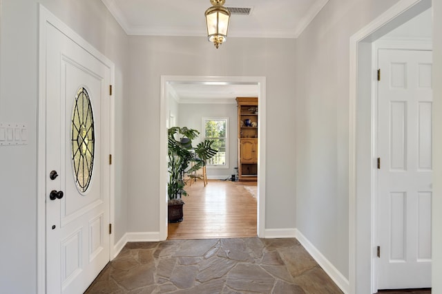 entryway featuring hardwood / wood-style flooring and crown molding