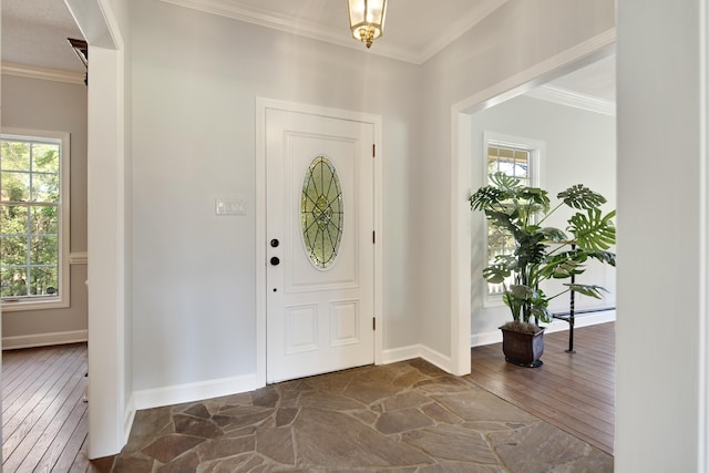 entryway featuring ornamental molding, dark hardwood / wood-style floors, and plenty of natural light