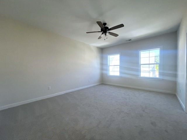 unfurnished room featuring carpet and ceiling fan