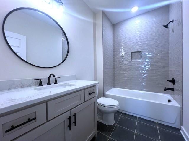 full bathroom with tile patterned floors, vanity, toilet, and tiled shower / bath