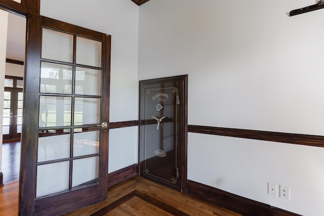 room details featuring crown molding, french doors, and wood-type flooring