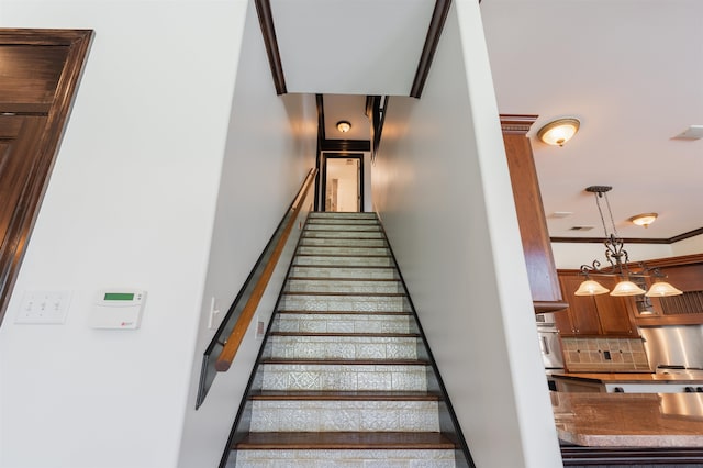 stairway with crown molding