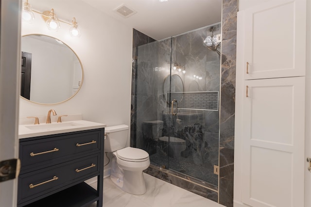 bathroom featuring vanity, toilet, and an enclosed shower