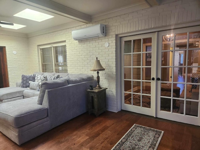 living room featuring a skylight, a wall unit AC, beamed ceiling, brick wall, and dark hardwood / wood-style floors