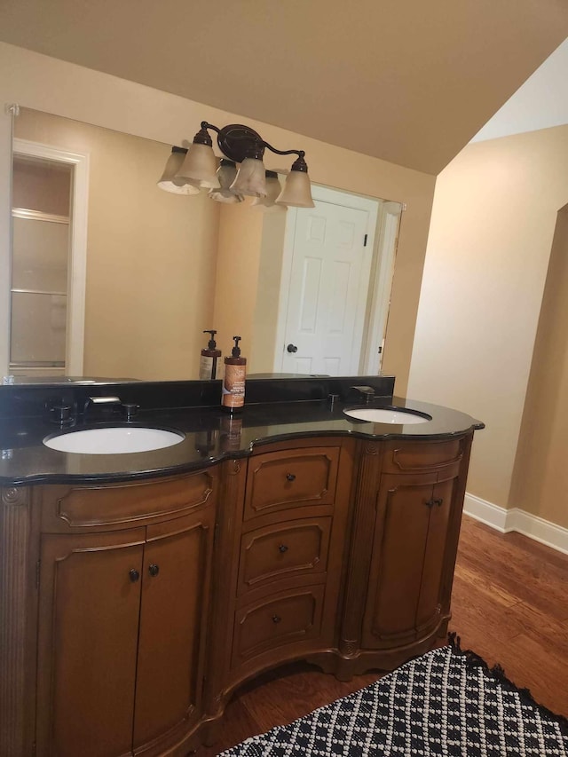 bathroom featuring vanity and hardwood / wood-style floors