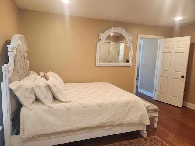 bedroom featuring dark hardwood / wood-style flooring