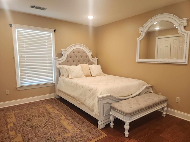 bedroom featuring dark hardwood / wood-style flooring