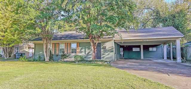 ranch-style home with a carport and a front yard