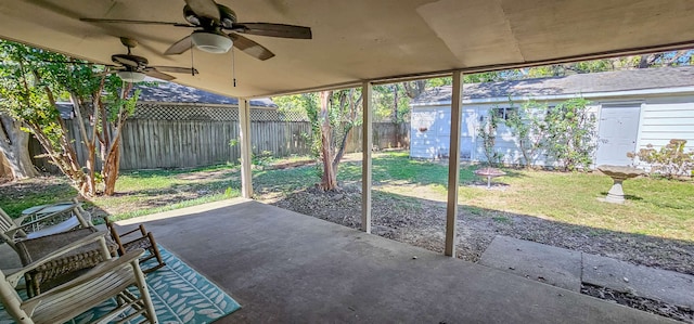 unfurnished sunroom with ceiling fan and vaulted ceiling