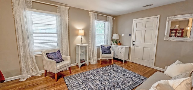 sitting room with hardwood / wood-style floors