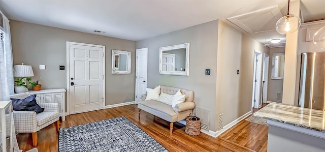 sitting room with dark hardwood / wood-style flooring