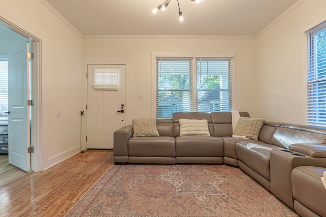 living room with light hardwood / wood-style floors and crown molding