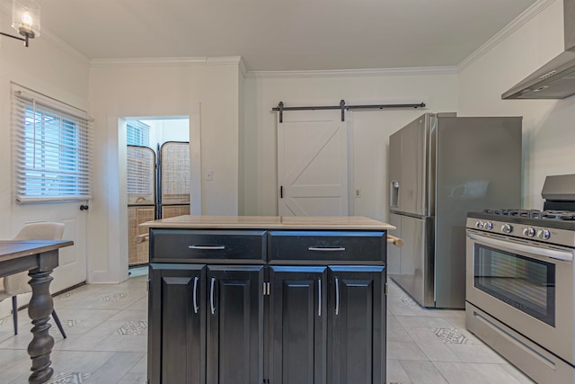 kitchen with wall chimney exhaust hood, stainless steel appliances, a center island, crown molding, and a barn door