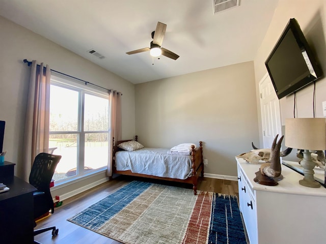 bedroom featuring hardwood / wood-style flooring and ceiling fan