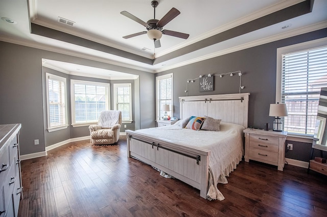 bedroom featuring ceiling fan, dark wood-type flooring, and multiple windows