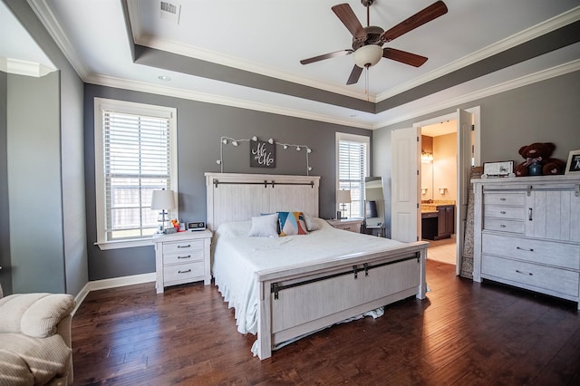 bedroom with ceiling fan, ensuite bath, dark hardwood / wood-style flooring, and multiple windows