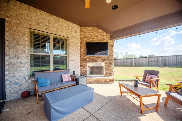 view of patio / terrace featuring an outdoor living space with a fireplace