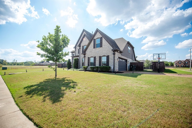 view of front facade with a front yard and a garage