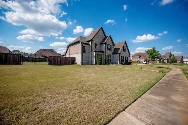 view of side of property featuring a lawn