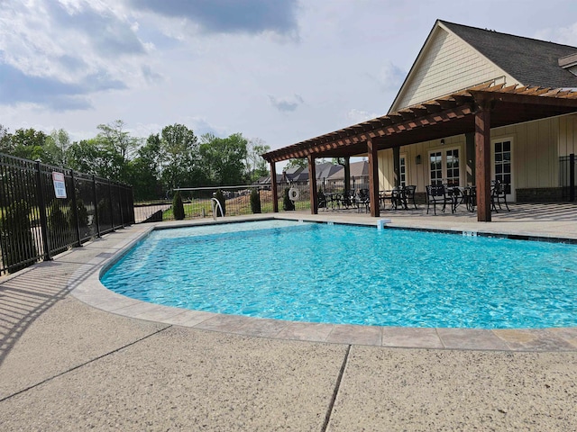 view of swimming pool with a pergola and a patio area