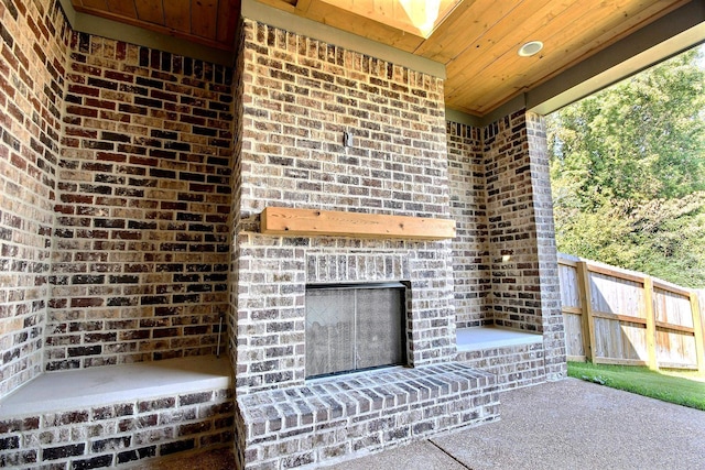 view of patio / terrace with an outdoor brick fireplace