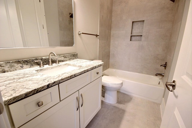 full bathroom featuring tile patterned floors, toilet, vanity, and tiled shower / bath combo