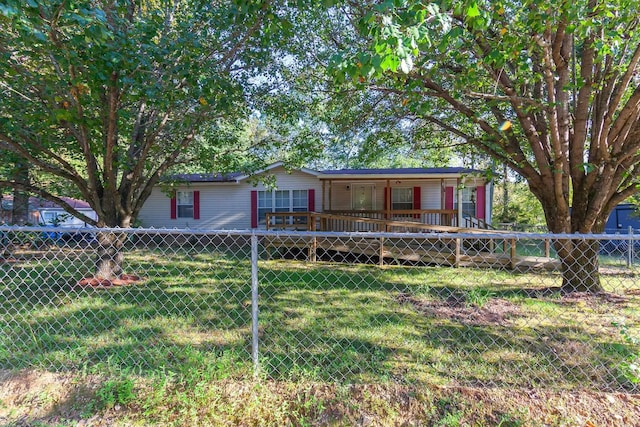 view of front of house featuring a front yard and a deck