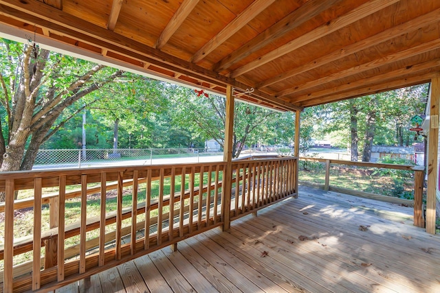 wooden terrace with a lawn