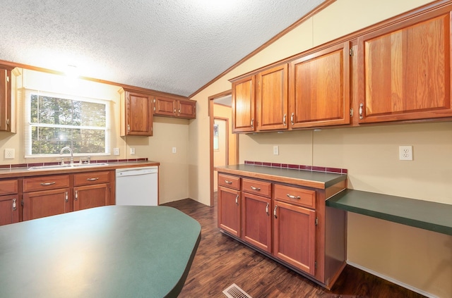 kitchen with white dishwasher, a textured ceiling, sink, and dark hardwood / wood-style flooring