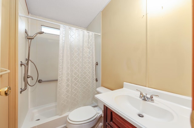 bathroom with toilet, vanity, curtained shower, and a textured ceiling