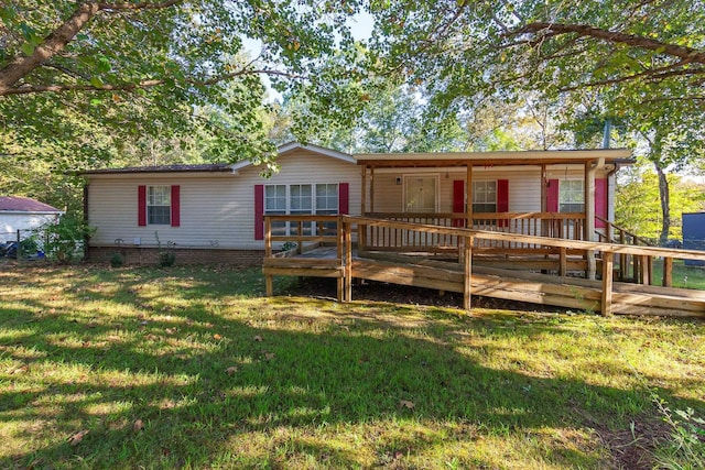 view of front facade featuring a front yard and a deck