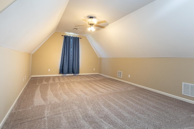 bonus room with lofted ceiling, carpet floors, and ceiling fan