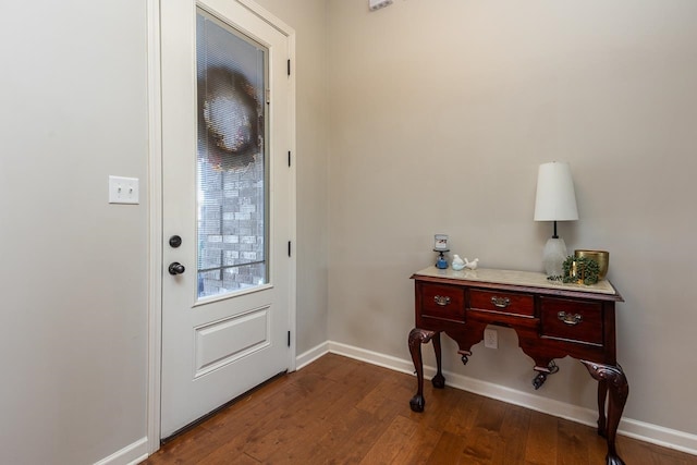 doorway featuring dark hardwood / wood-style floors