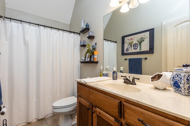 bathroom featuring lofted ceiling, tile patterned floors, vanity, and toilet